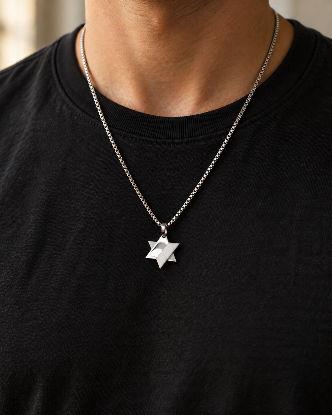 Koch La Ni split finish Star of David necklace, half polished and half matte, worn over a black t-shirt