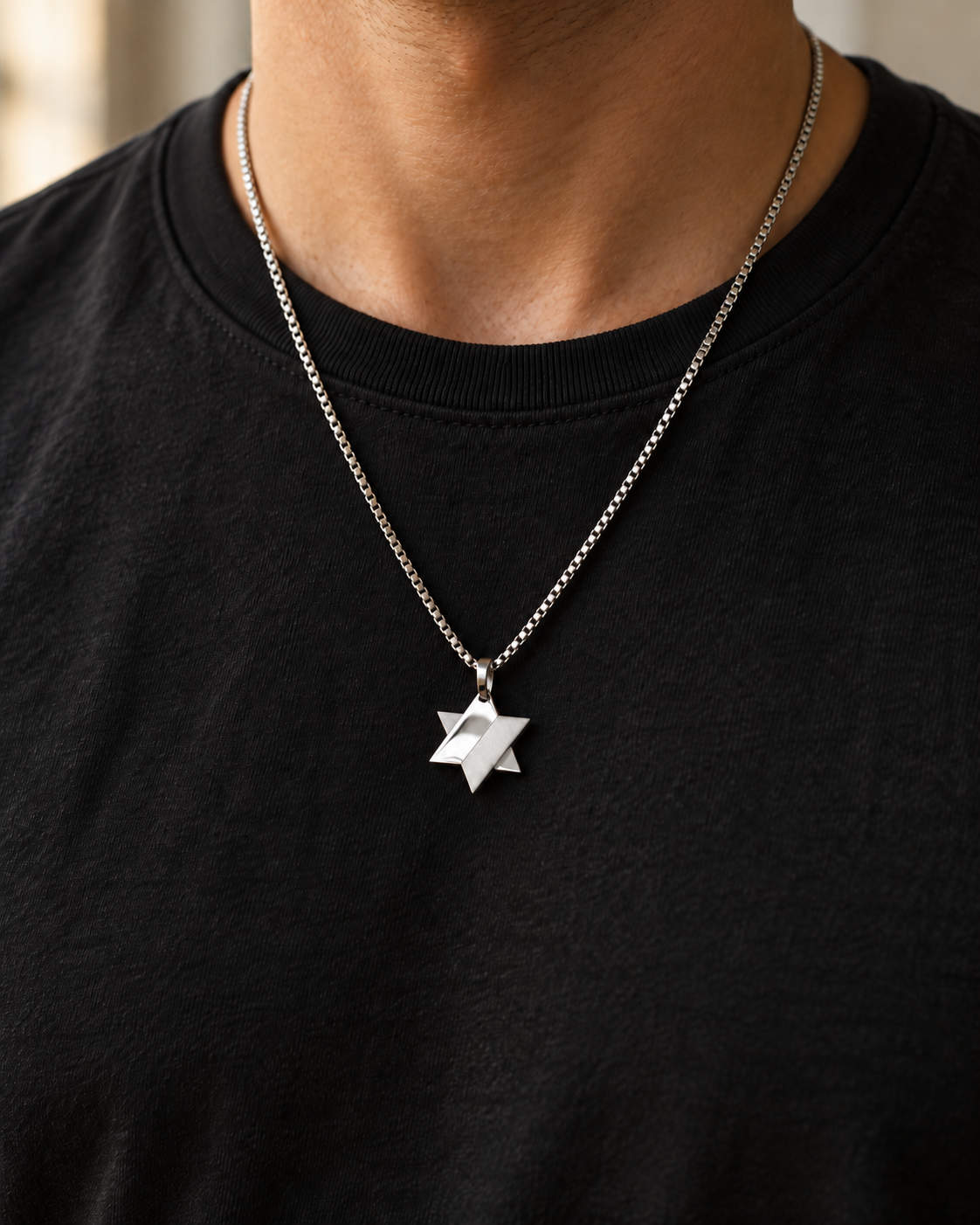 Koch La Ni split finish Star of David necklace, half polished and half matte, worn over a black t-shirt