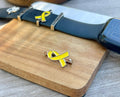 Yellow ribbon BringThemHomeNow watch band charm, part of The Watch Charm Set by Koch La Ni