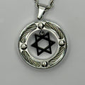 Black Star of David suspended inside a stainless steel cable ring pendant