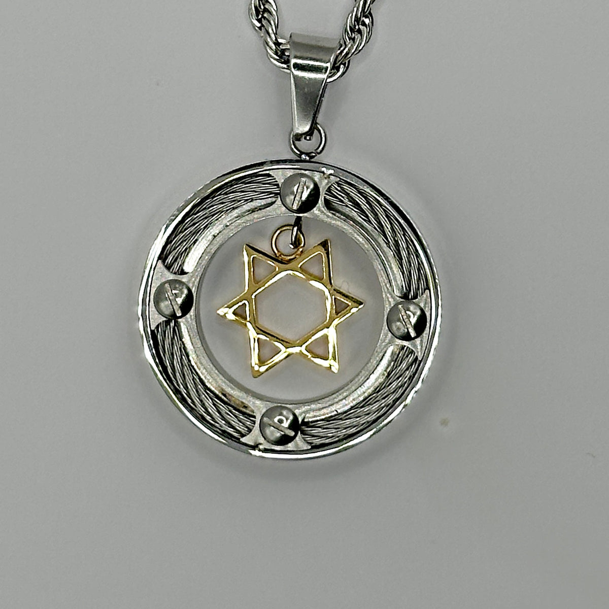 18K gold plated Star of David suspended inside a stainless steel cable ring pendant
