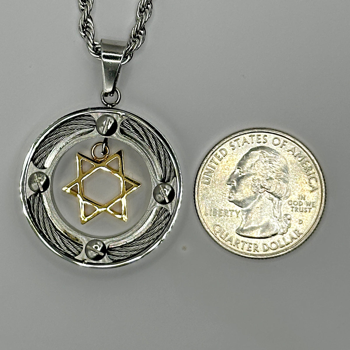 Cable Ring Star of David pendant shown beside a US quarter for scale
