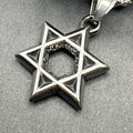 Close-up of the blackened Star of David showing polished edges and dark faces