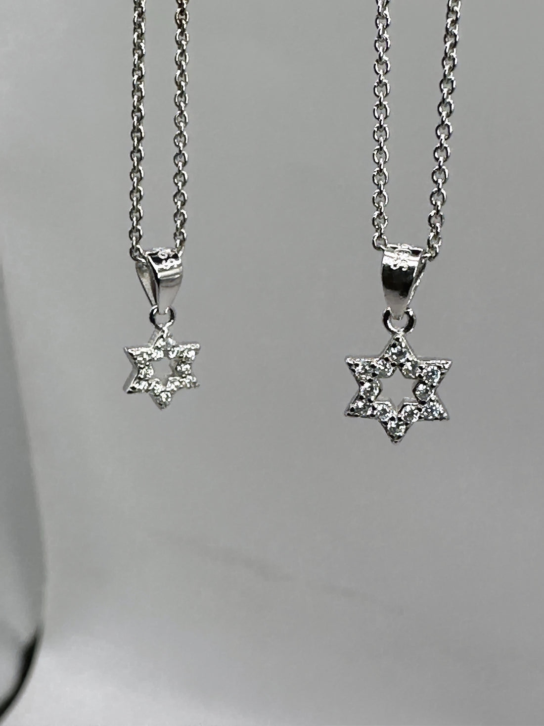 Small and large dainty pavé Star of David necklaces in 925 sterling silver