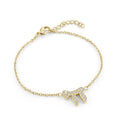 Dainty Chai bracelet in gold ion plated stainless steel set with white cubic zirconia on an adjustable cable chain