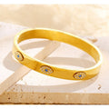 18K gold plated Evil Eye bangle bracelet with cubic zirconia by Koch La Ni